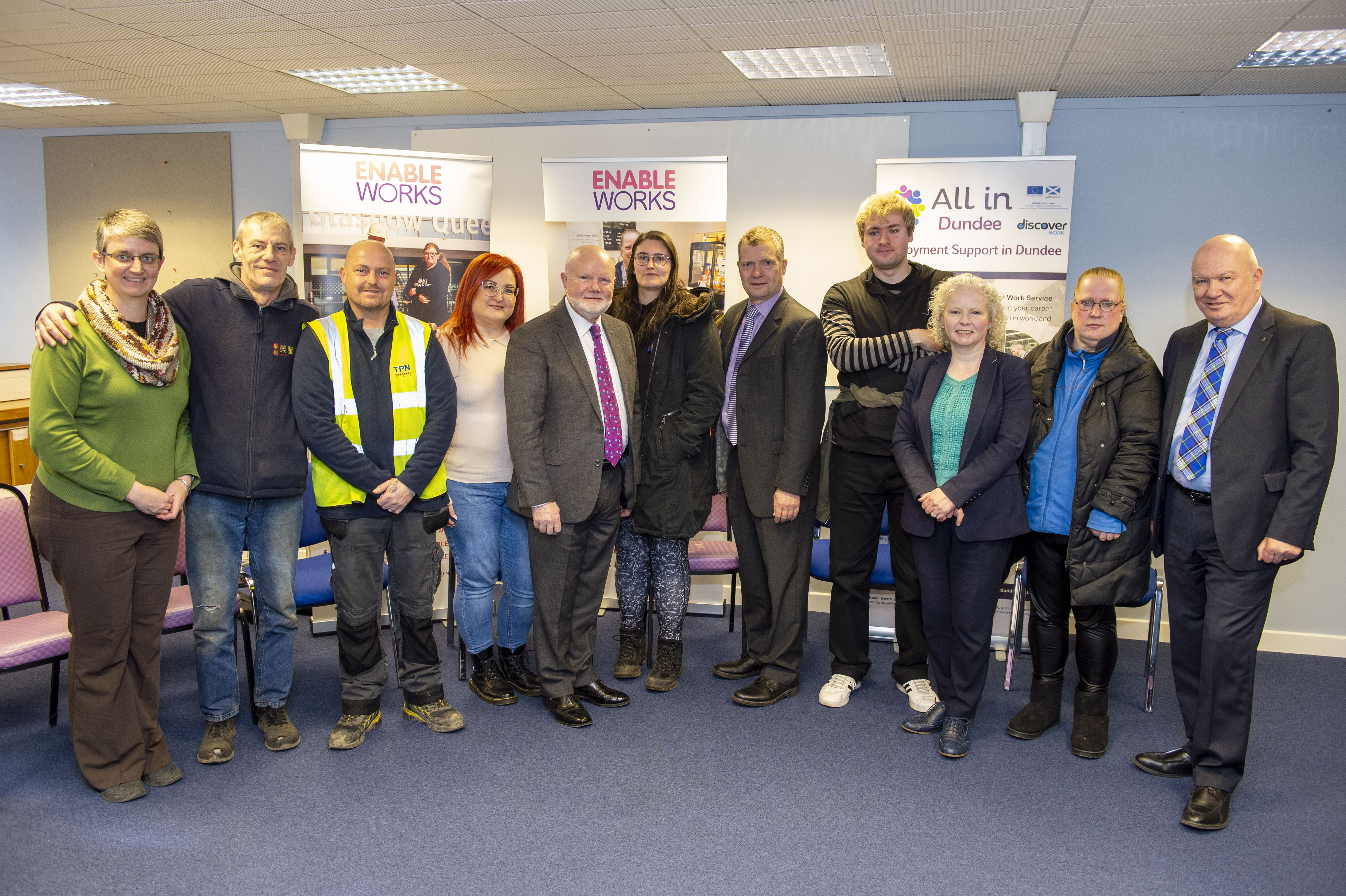 This image shows members of the Committee with clients from ENABLE Works