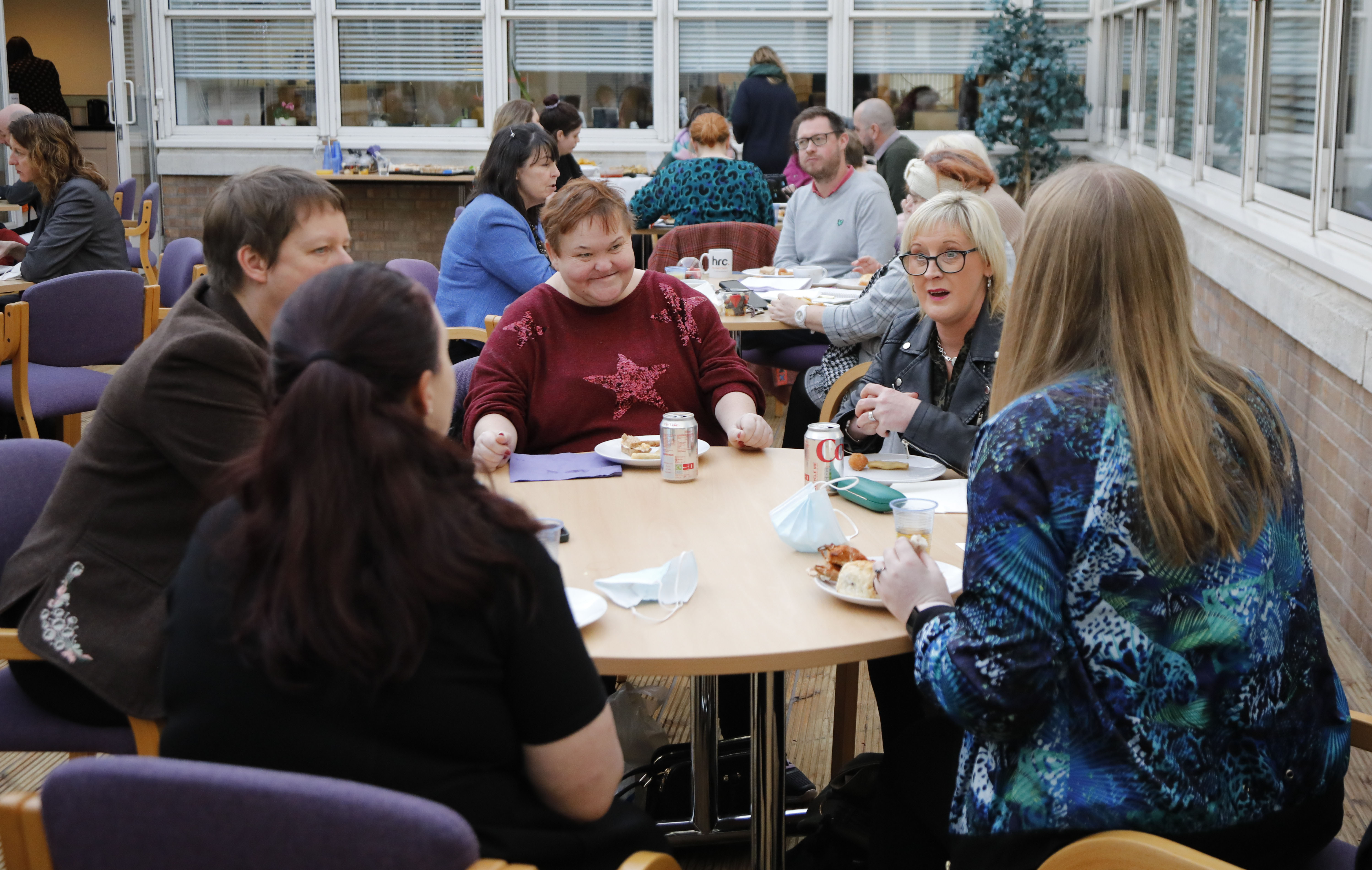 A picture of Committee Members speaking to care service users in Glasgow